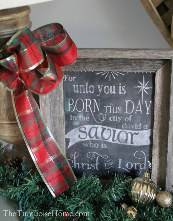 Stunning mantel decor with plaid bow and chalkboard written with a message.