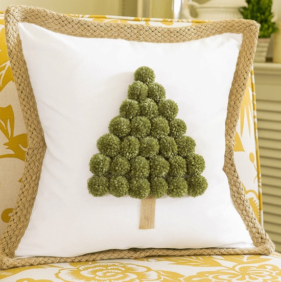 Unique pom pom Christmas tree pillow.