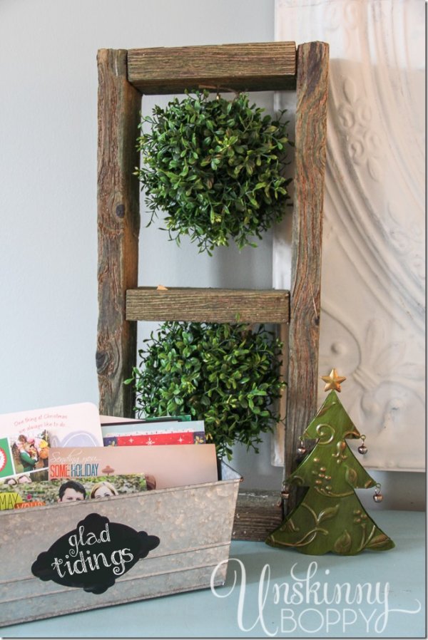Wooden ladder beautifully decorated by greenery.