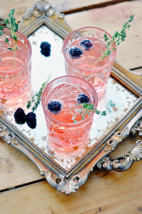Bubbly love potion made with sparkling wine and blackberry syrup.