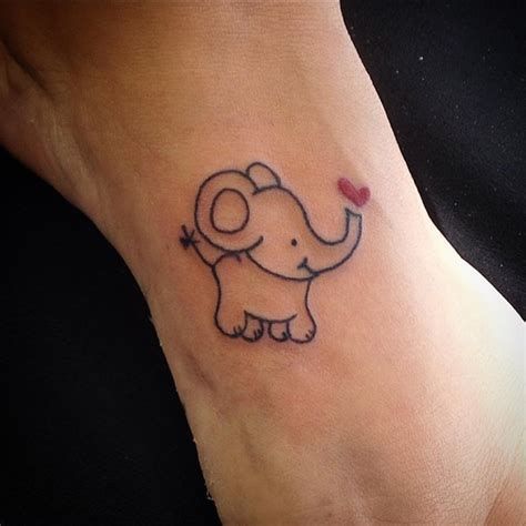 Adorable fineline elephant tattoo with heart.