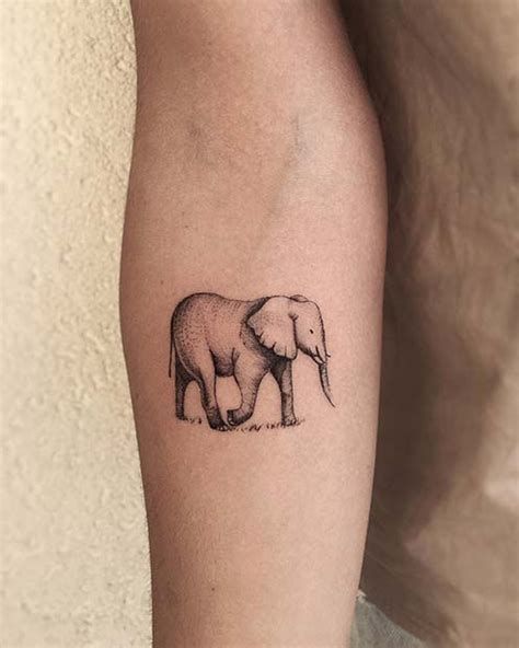 Cool arm elephant tattoo.