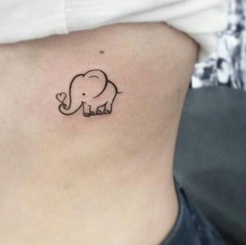 Cute elephant tattoo with heart.