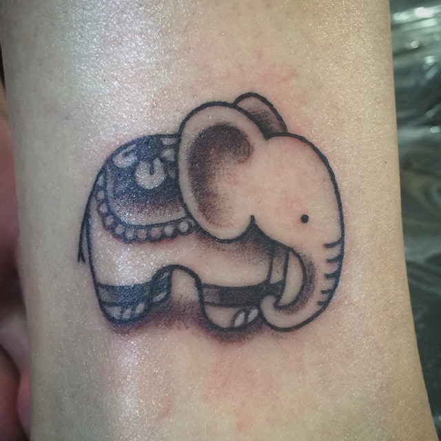 Dashing baby elephant tattoo.