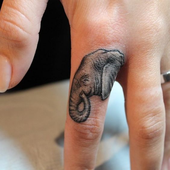 Elephant finger tattoo.