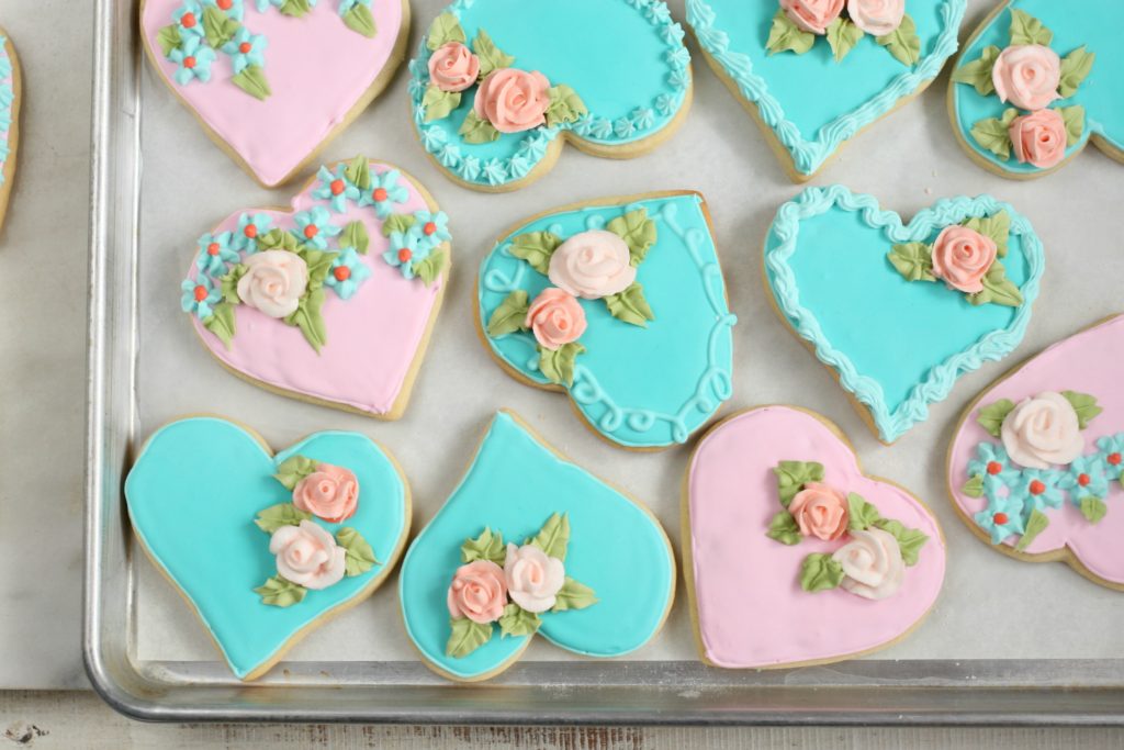 Floral decorated heart shape cookies.