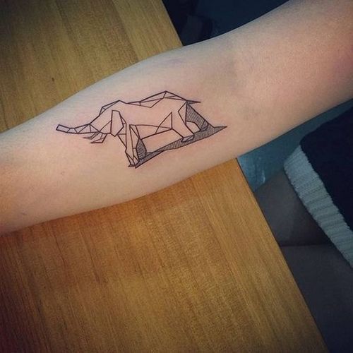 Geometric elephant tattoo on forearm.