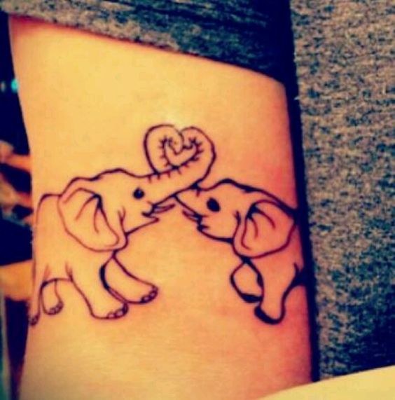 Lovely pair of elephant tattoos.