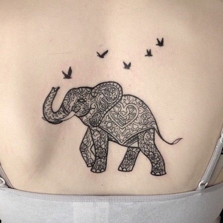 Pattern elephant tattoo on back.
