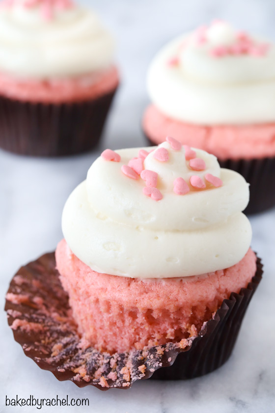 Pink velvet cupcakes with cream cheese frosting.