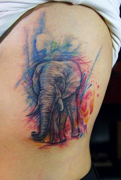 Ravishing water color elephant tattoo on side.
