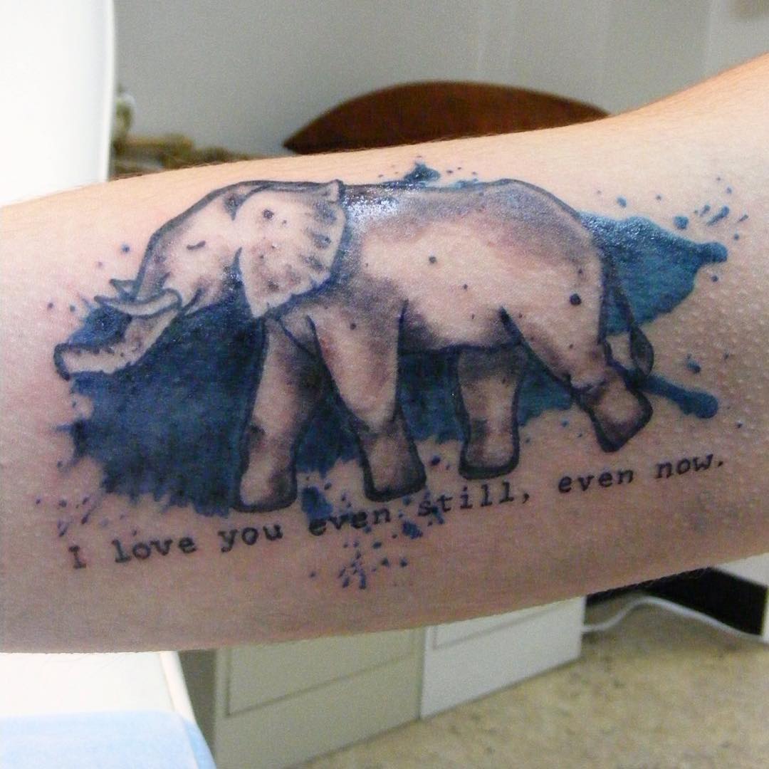 Stunning watercolor elephant forearm tattoo.