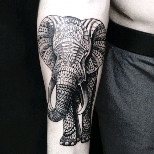 Swanky elephant tattoo on forearm.
