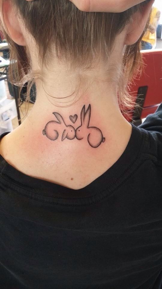 Awesome couple bunny tattoo on neck.