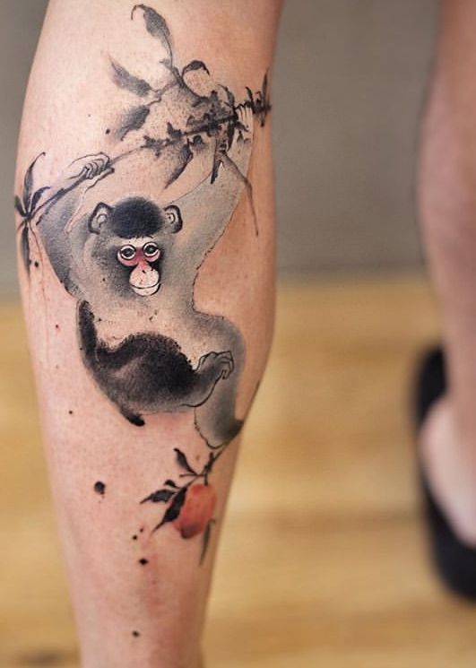 Black & grey monkey tattoo on leg.