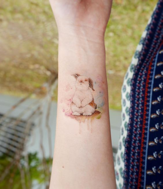 Bunny with watercolor on wrist.