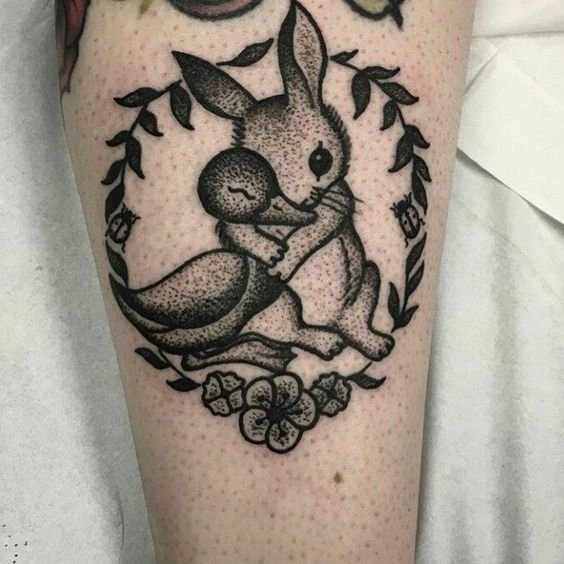 Cool duck and bunny tattoo.