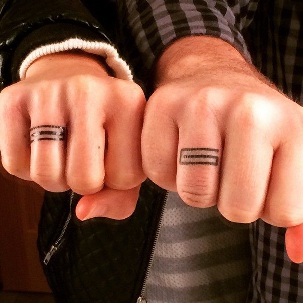 Cool matching wedding ring tattoo.