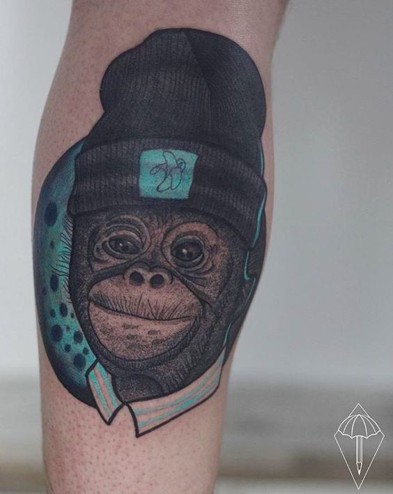 Cool monkey tattoo with a hat.