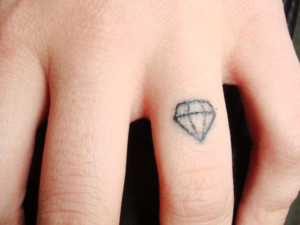 Cost effective diamond ring tattoo.
