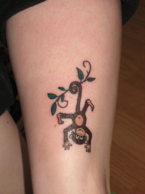 Cute hanging monkey tattoo.
