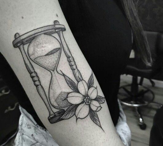 Dot work Geometric Hourglass with flower Forearm Tattoo.