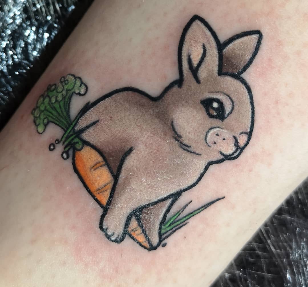Easter bunny tattoo with carrot.
