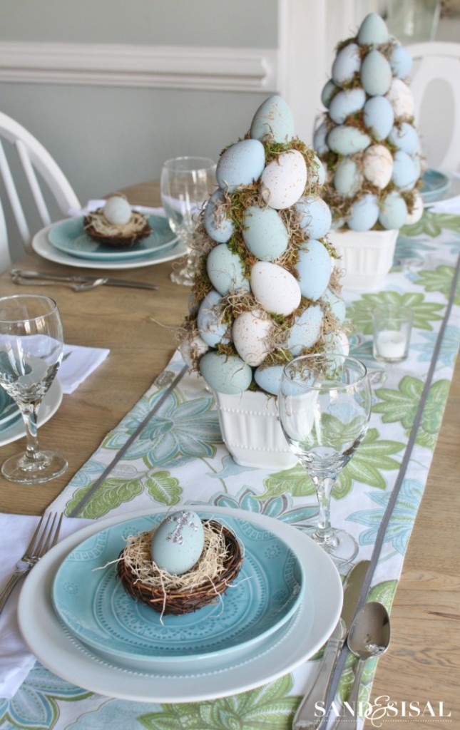Eye-catching Easter topiary trees as centerpiece.
