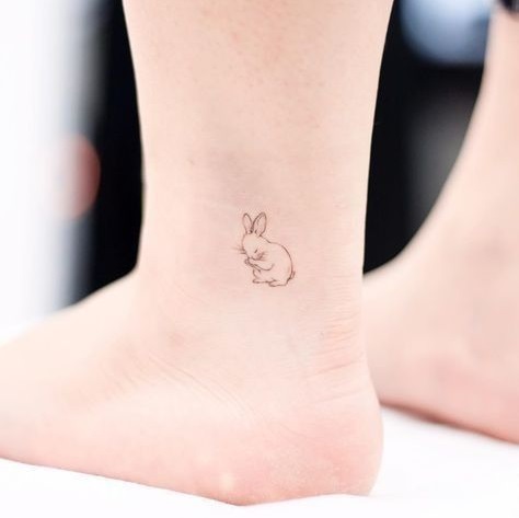 Fineline bunny tattoo on ankle.