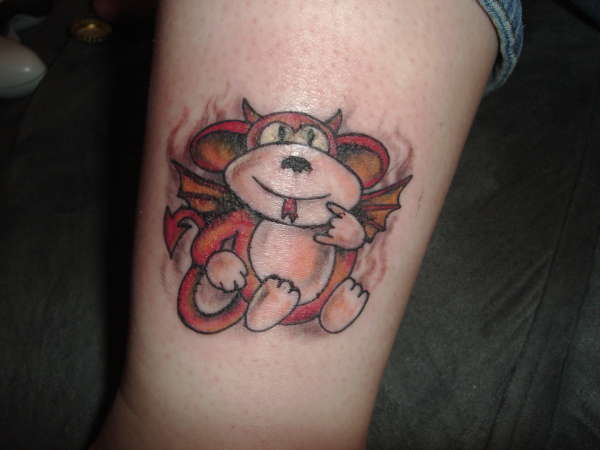 Funky little devil monkey tattoo.