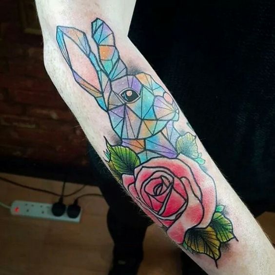 Geometric bunny tattoo with rose.