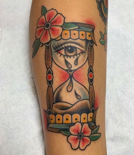 Hourglass with eyes and flowers.