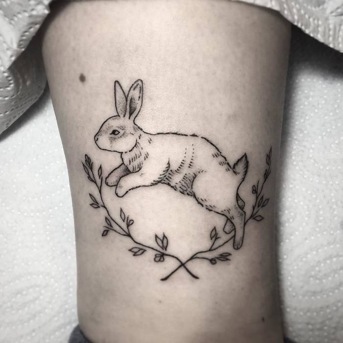 Jumping bunny tattoo.