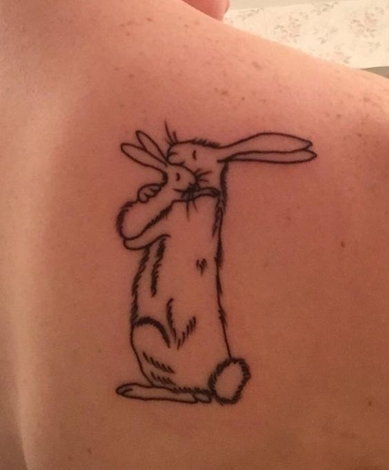 Love this mother baby bunny shoulder tattoo.