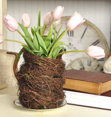 Nest vase from a grapevine wreath with tulips.