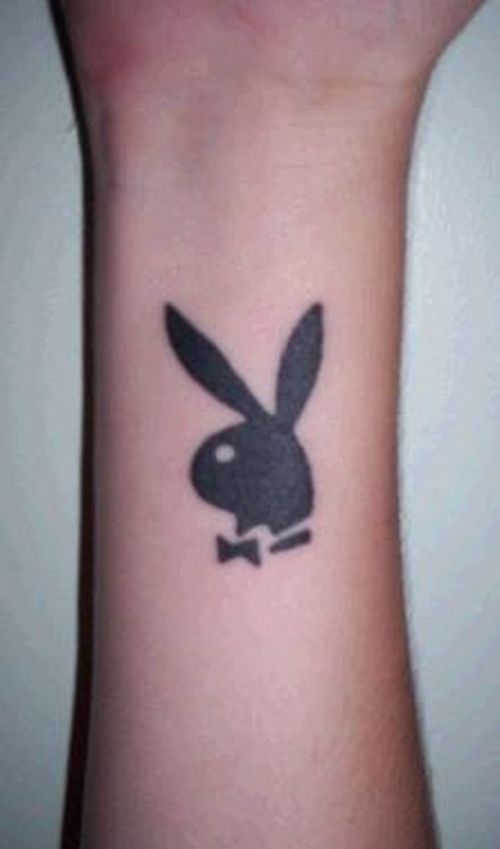 Playboy bunny tattoo on wrist.