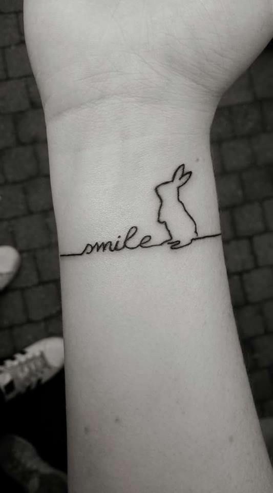 Pretty single line bunny tattoo on wrist.