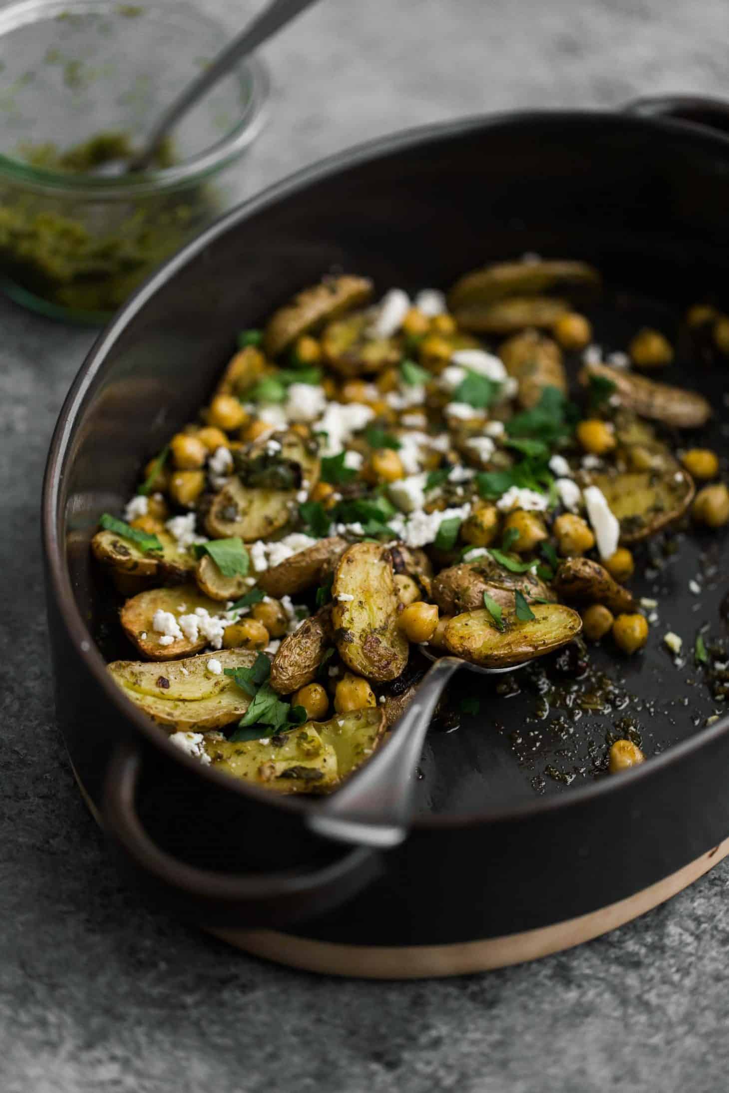 Roasted potatoes and chickpeas with green harissa.