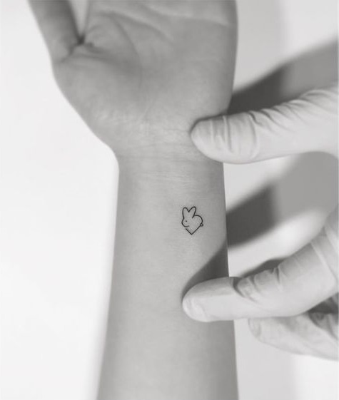 Simple bunny with heart on wrist.