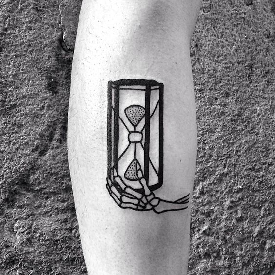 Skeleton holding hourglass tattoo idea.