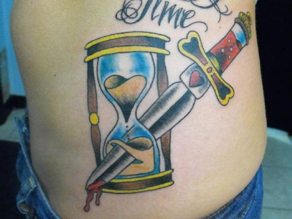The beautiful dagger piercing the hourglass stands for the waste of time.
