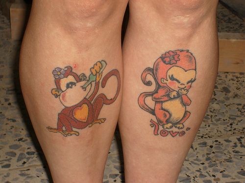 Twin monkey tattoos.