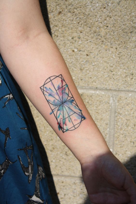 Watercolor hourglass tattoo.