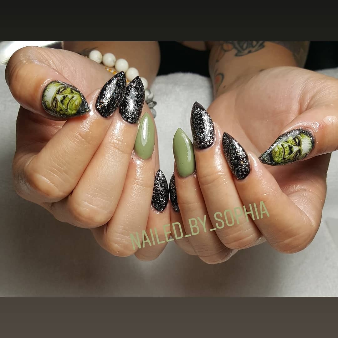 Glitter black and green nails with ghost. Pic by nailed_by_sophia