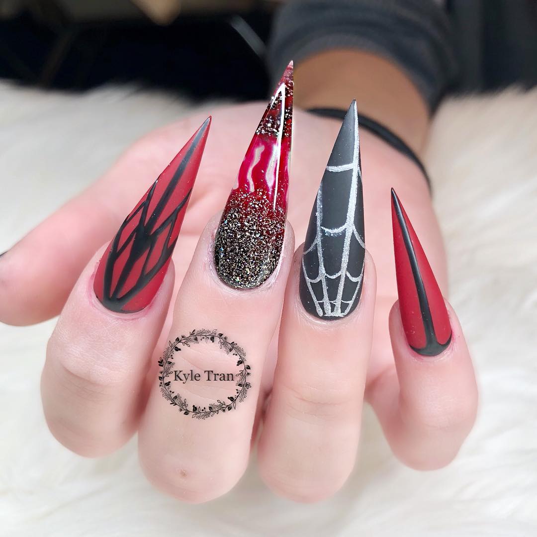 Red and black stiletto spider web nail art ideas. Pic by nailsbykyle_ca